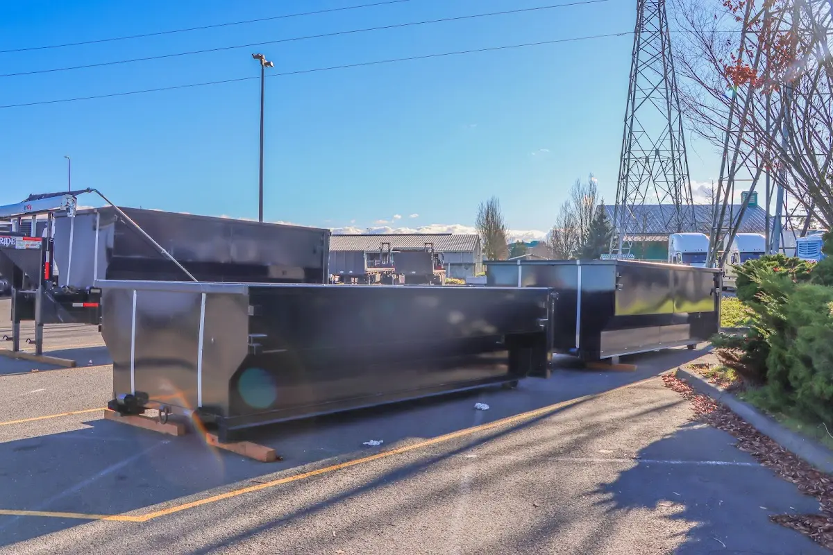 Roll-off dumpster ready for waste disposal at job site for 2 Yard Dumpster Rental in Albert Lea